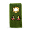 Cherry stud earrings on a velvet gift tag with a golden grommet.
