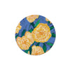 Floral coasters from Margaret Jeane, featuring a vibrant yellow bloom design against a blue background.
