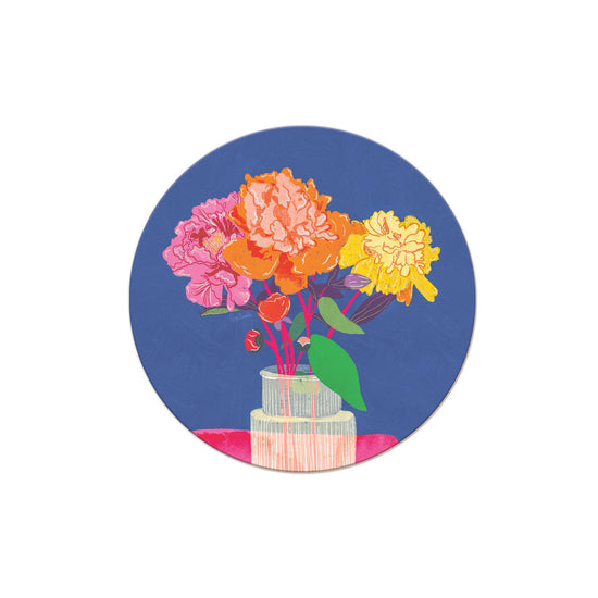 Round floral coaster with peony blossoms on a blue background.