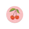 Cherry art coaster from Seedlings Coasters featuring a pink background and a ripe cherries illustration.