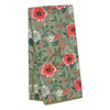 Floral sage towel by Karma Living featuring red poppies, white blossoms, and green leaves.