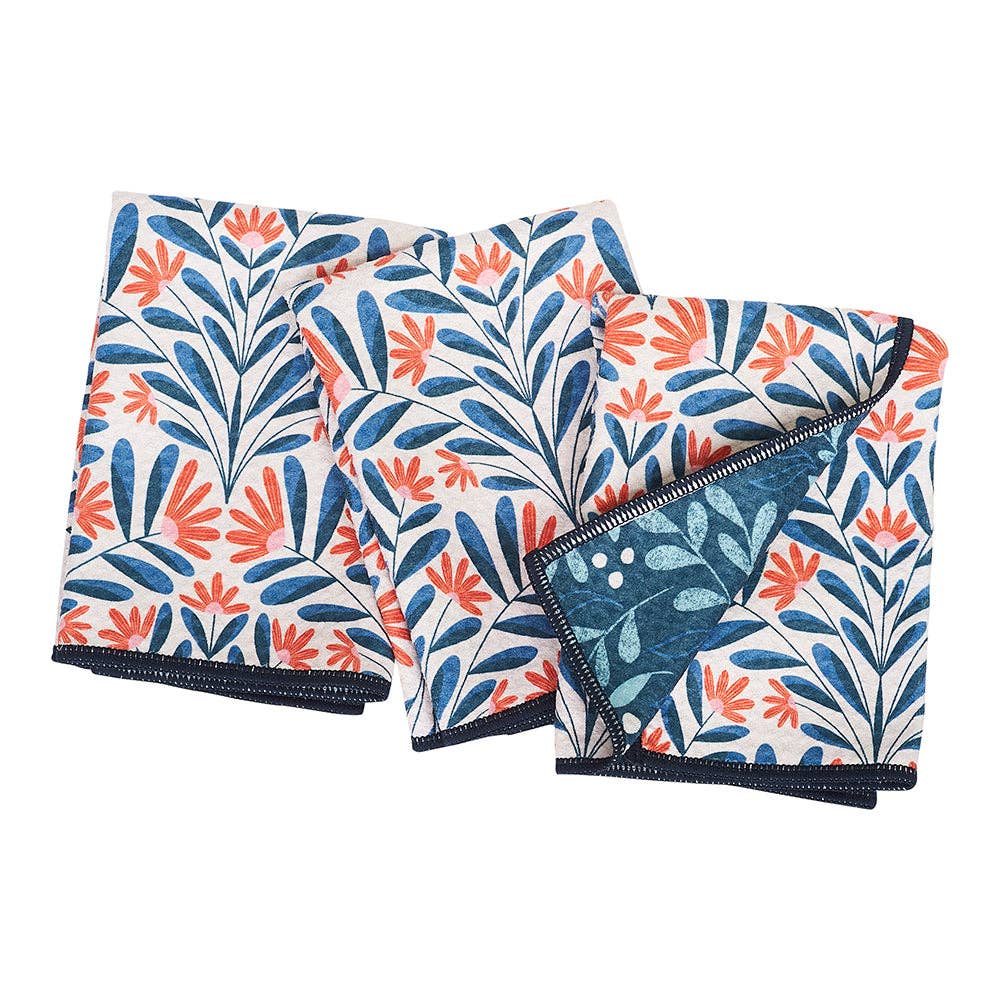 Set of three kitchen towels by RJW, featuring orange floral and blue botanical pattern on a light background.