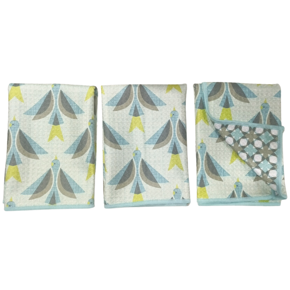Set of three reversible multicolor mini towels by HJ Sparrow, featuring a geometric bird pattern and blue trim.
