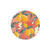 Set of coasters with floral print by Margaret Jeane, featuring lemons, flowers, and green leaves on a coral background.
