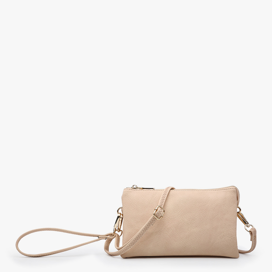 Light peach crossbody and wristlet by Monogrammable with a gold-toned zipper closure and an adjustable strap.