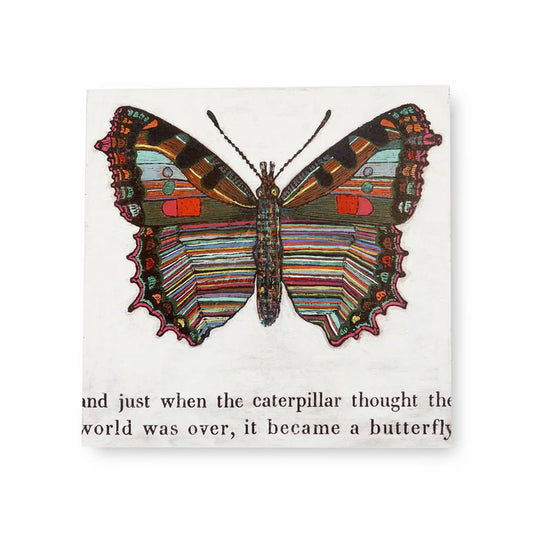 Square art tile with butterfly design above inspirational text by an unknown designer.