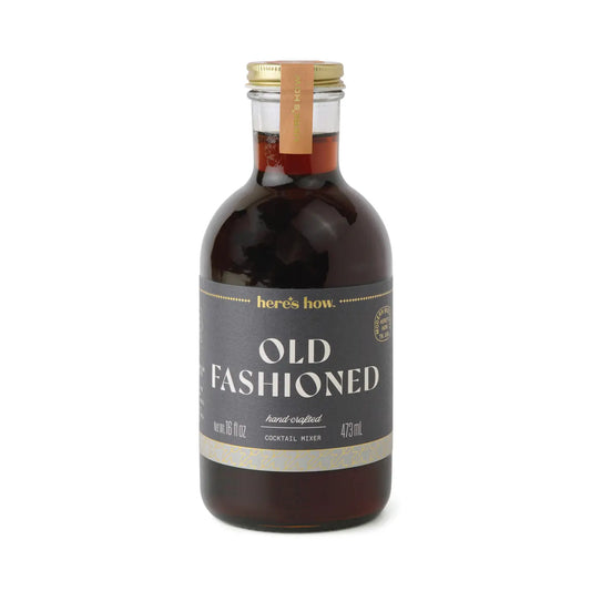Old Fashioned cocktail mixer by Here's How with gold accents on the label.