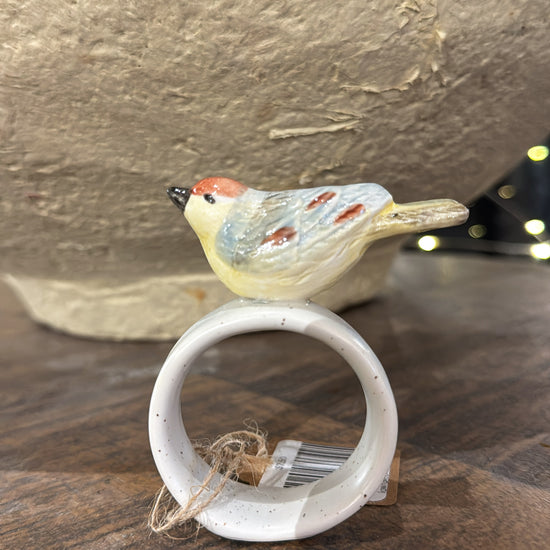 Stoneware napkin ring with bird by Creative Co-Op, featuring a reactive glaze finish and twine accent.
