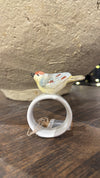 Stoneware napkin ring with bird by Creative Co-Op, featuring a reactive glaze finish and twine accent.
