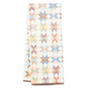 Multicolor dish towel with star quilt pattern by Crate & Barrel, with textured surface and a brown trim.