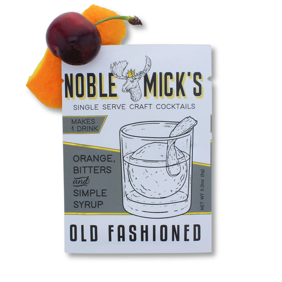 Single-serve Old Fashioned cocktail pack by Noble Mick's, with an illustration of a cocktail glass, cherry and orange garnish.
