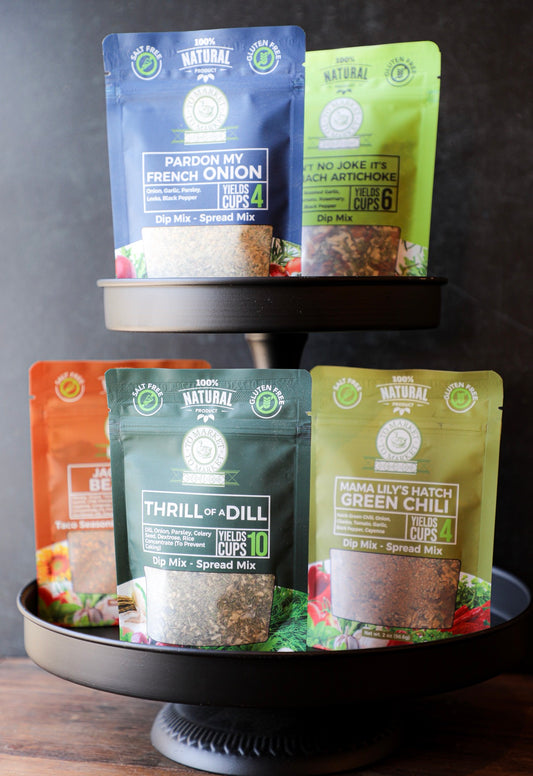 Assorted gourmet dip mixes by To Market to Market displayed on a two-tiered serving stand.
