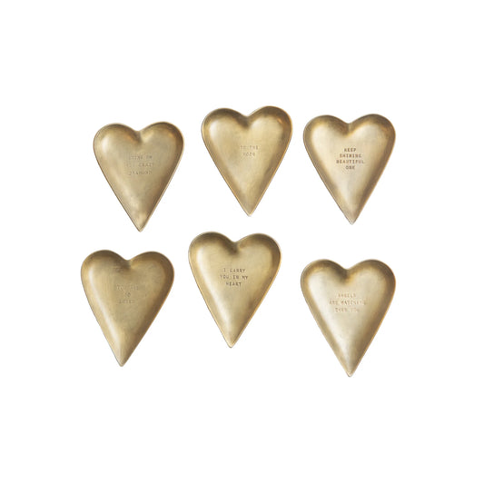 Brass trinket trays from Creative Co-Op featuring heart shapes with varying sentimental quotes.