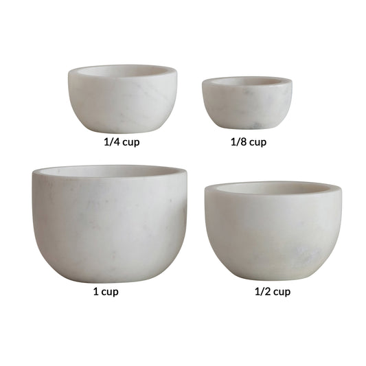 Set of four white marble bowls by unknown vendor, including 1 cup, 1/2 cup, 1/4 cup, and 1/8 cup sizes.