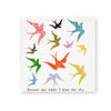 Square art tile by an unknown brand featuring colorful swallows and the phrase "Excuse me while I kiss the sky".
