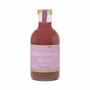 Blackberry Basil Cocktail Mixer by Here's How, in a clear glass bottle with a gold cap.