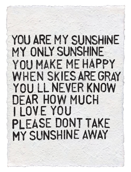 Handmade paper print by unknown vendor, featuring the "You Are My Sunshine" song lyrics in black ink on textured white paper.
