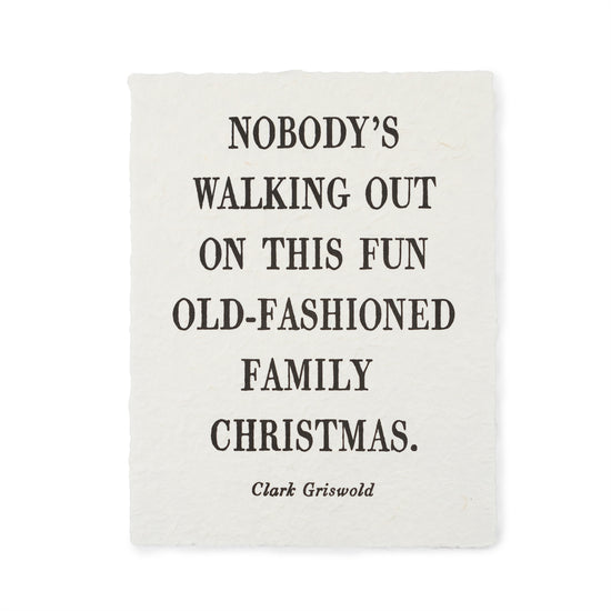 Handmade paper print by Clark Griswold featuring bold font with a textured surface.
