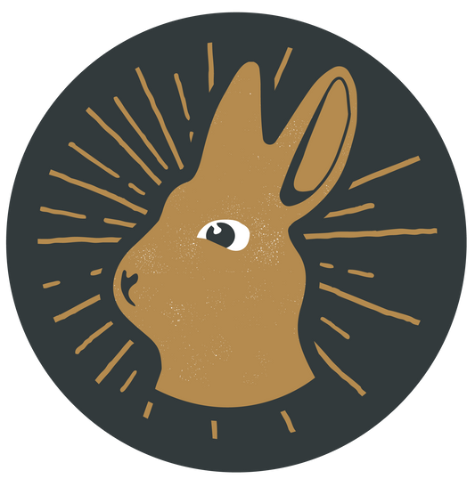 Gift card with a hare illustration by Living|Room, in a circular design with a black background.