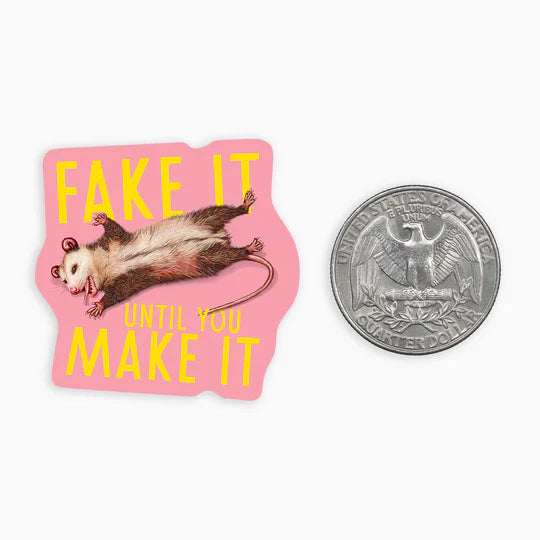 Mini sticker with a possum design by Ectogasm on a pink background next to a quarter.