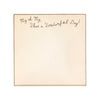 Square notepad with "My oh My, What a Wonderful Day!" inscription, on an off-white paper with a black border.