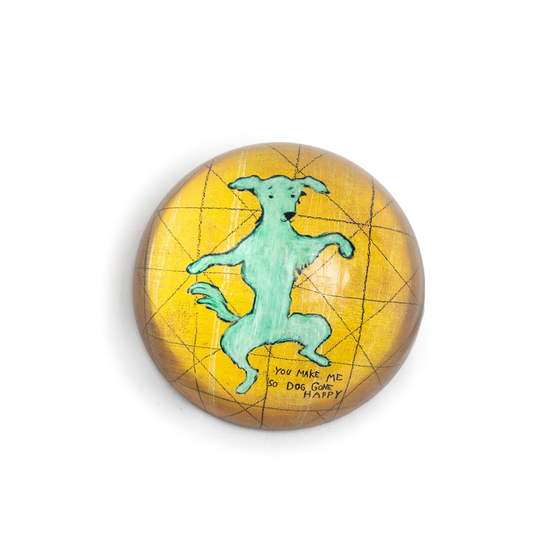 Yellow decorative paperweight by Sugarboo & Co. featuring a dancing dog with a grid pattern and handwritten saying.