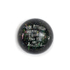 Round paperweight by Sugarboo & Co., featuring splattered colors with a handwritten-style message.
