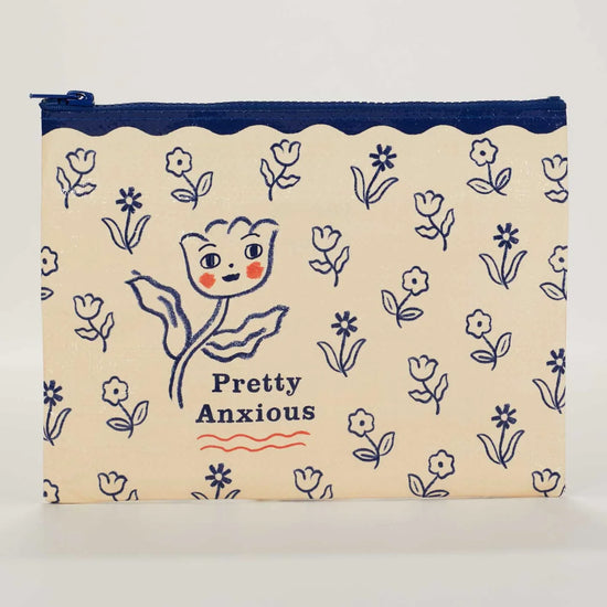 Zipper pouch by Blue Q with blue floral patterns and a flower face graphic and "Pretty Anxious" text.