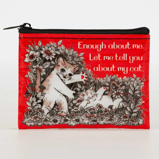 Red coin pouch by Blue Q with a humorous cat graphic and floral illustrations.
