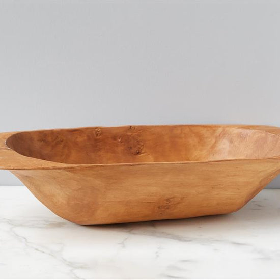 Food safe, light-brown dough bowl by HomArt, sitting on a marble countertop against a light gray background.
