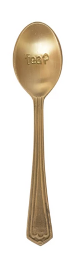 Gold engraved spoon with "tea?" on the head, textured handle.