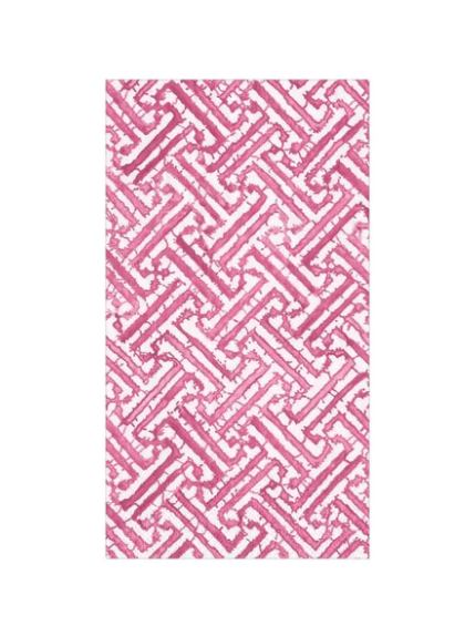 Set of fretwork guest napkins with pink pattern.