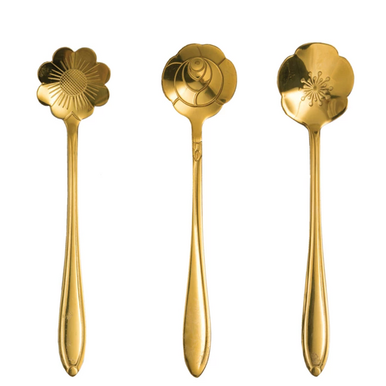 Set of three gold-tone stainless steel flower-shaped spoons with different floral patterns.