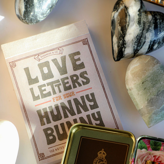 Love letters notepad by Sugarboo & Co., with a decorative frame and marble heart decorations.
