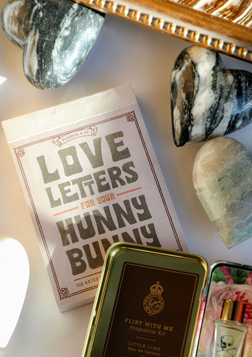 Love letters notepad by Sugarboo & Co., with a decorative frame and marble heart decorations.
