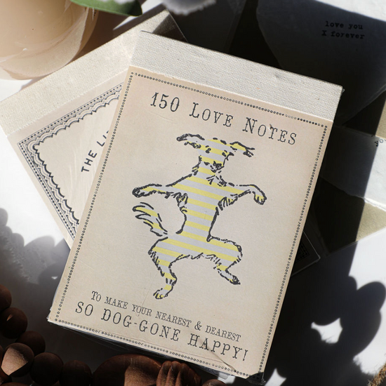 Love notes notepad from an unseen vendor, featuring a cartoon dog in yellow stripes.