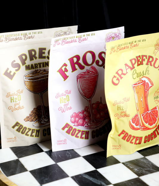 Three bags of Noble Mick's Frozen Cocktails by Noble Mick's on a checkerboard surface.