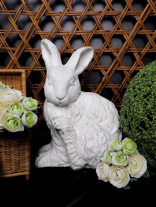 White faux concrete rabbit from Home Decor, surrounded by flowers and greenery.
