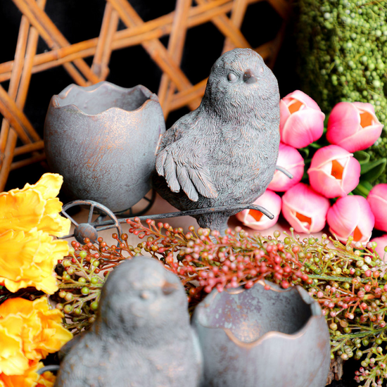 Resin chicks with egg carts home decor, featuring two birds and eggshell halves, on a miniature cart with colorful flower accents.