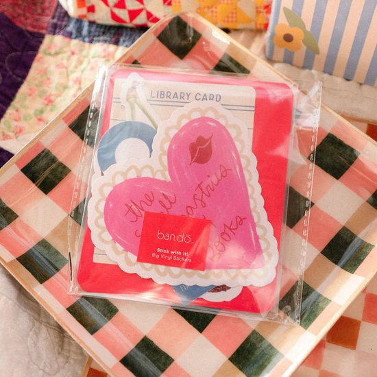 Packaged stickers with heart design on a checkered surface