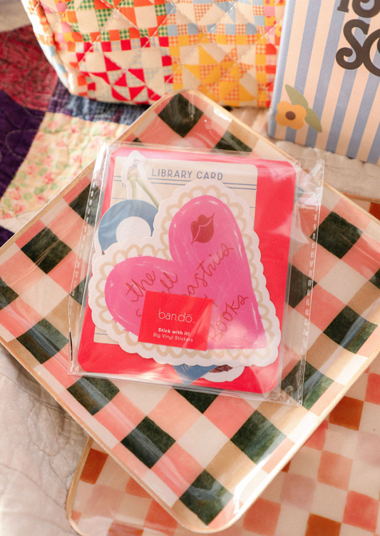 Packaged stickers with heart design on a checkered surface