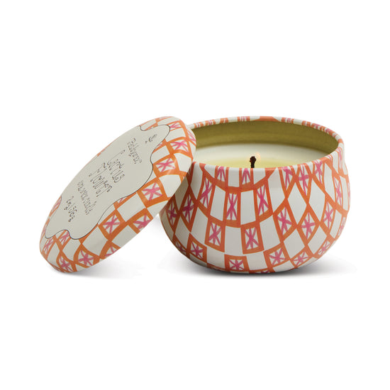 Patterned tin candle by an unspecified brand featuring a tulip print.
