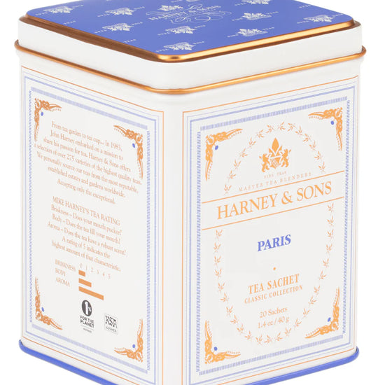 Tea tin by Harney & Sons featuring white, blue, and gold color scheme with text and decorative elements.
