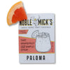 Single serve Paloma cocktail mix by Noble Mick's, shown with a grapefruit wedge on top.
