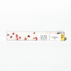 Raspberry champagne cubes by Luxe Mini, in a clear rectangular package with red petal pieces.