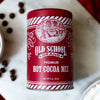Red tin of hot cocoa mix from Old School Brand with a vintage illustration and striped accents.
