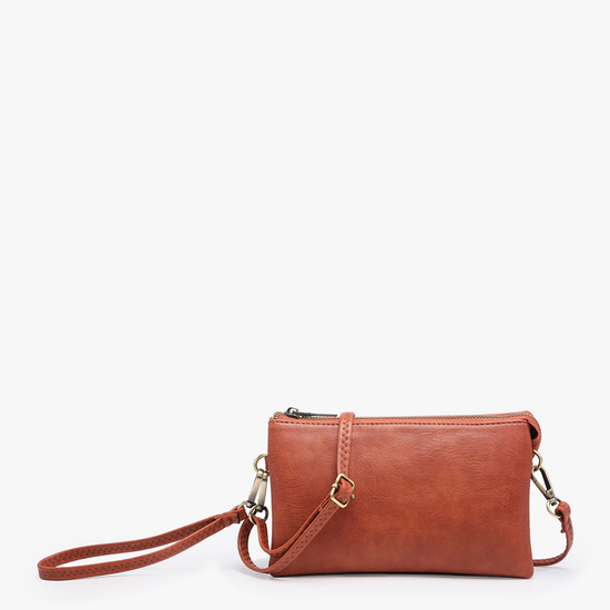 Rust crossbody wristlet by Spartina 449 with gold-tone hardware and top zipper.