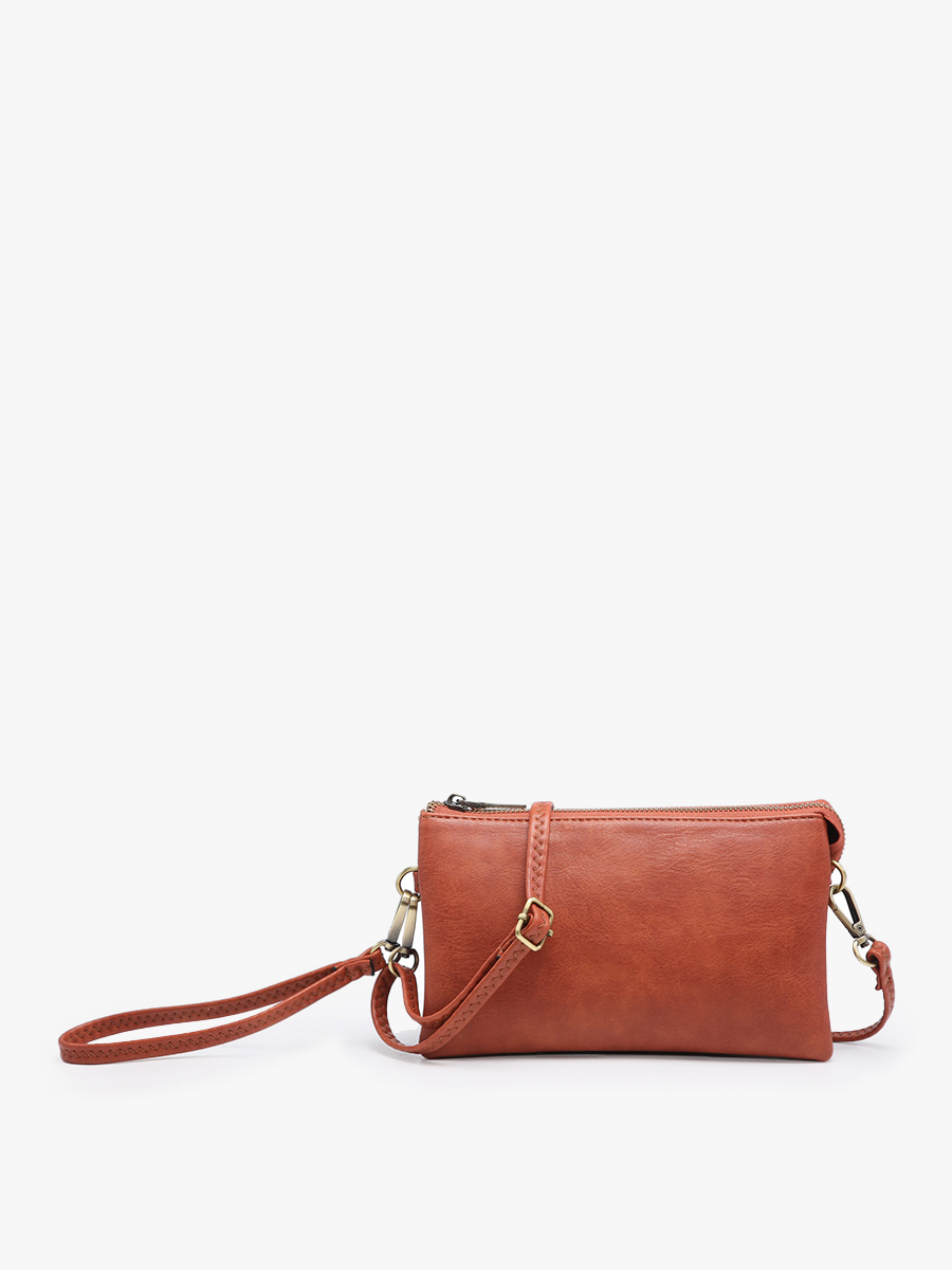 Rust crossbody wristlet by Spartina 449 with gold-tone hardware and top zipper.