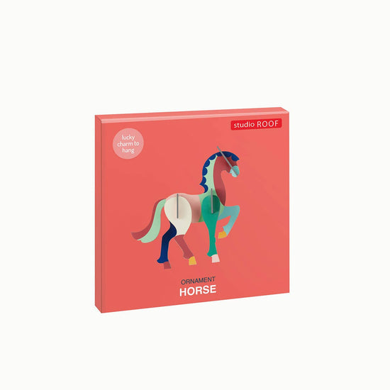 3D horse ornament by studio ROOF, with teal and burgundy geometric panels.