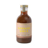 Ginger mule cocktail mixer by Here's How with a tan label and geometric pattern near the base.